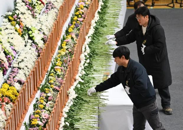 韩国空难悲剧，遗体寻找与安息之路的艰辛旅程